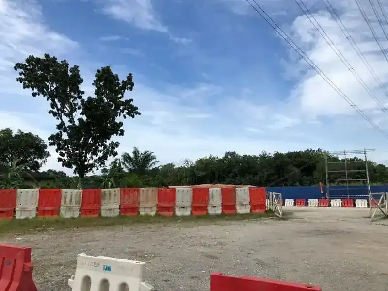 red white water-filled barriers construction site Malaysia
